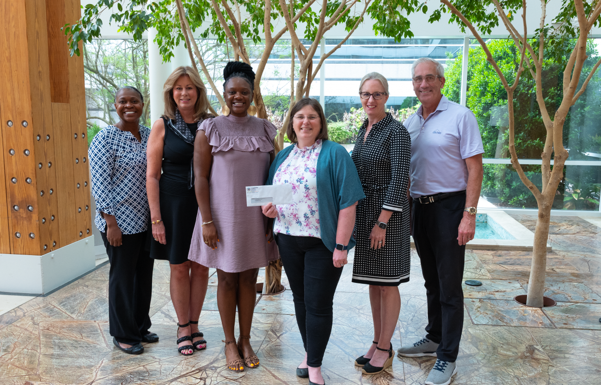 The Community Foundation of Greater Huntsville presents a check for $15,000 from its Racial Equity Fund to Hudsonalpha's Information is Power